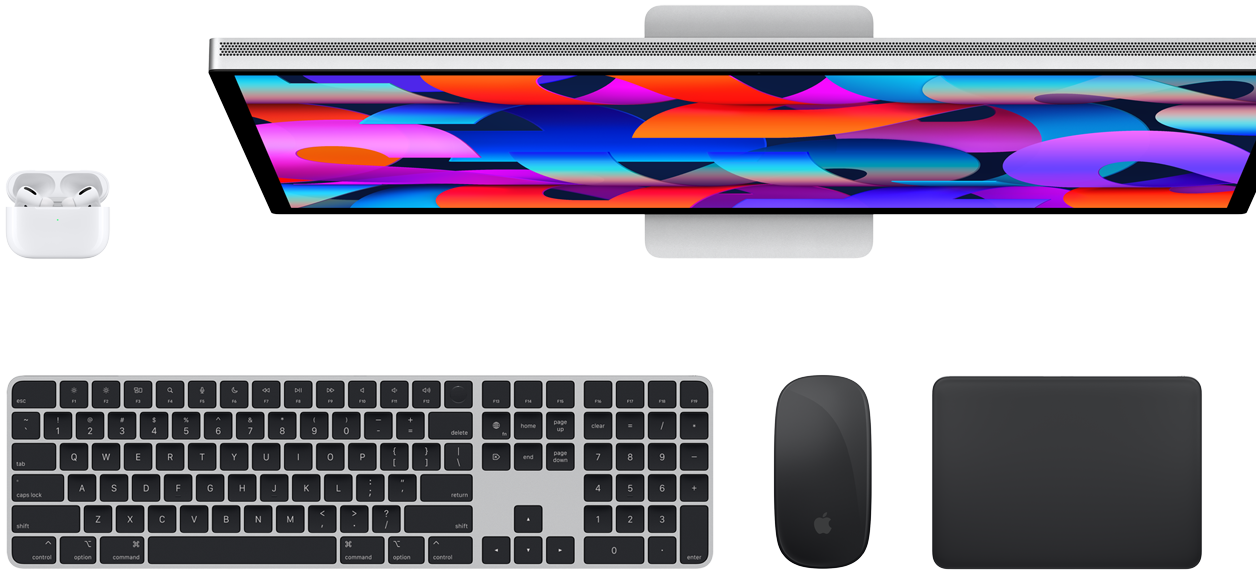 Top view of AirPods, Studio Display, Magic Keyboard, Magic Mouse, and Magic Trackpad
