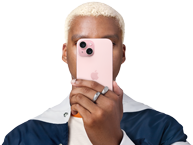 Person holding iPhone 15 in front of his face to conceal indentity